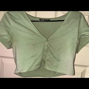 green and white crop top.